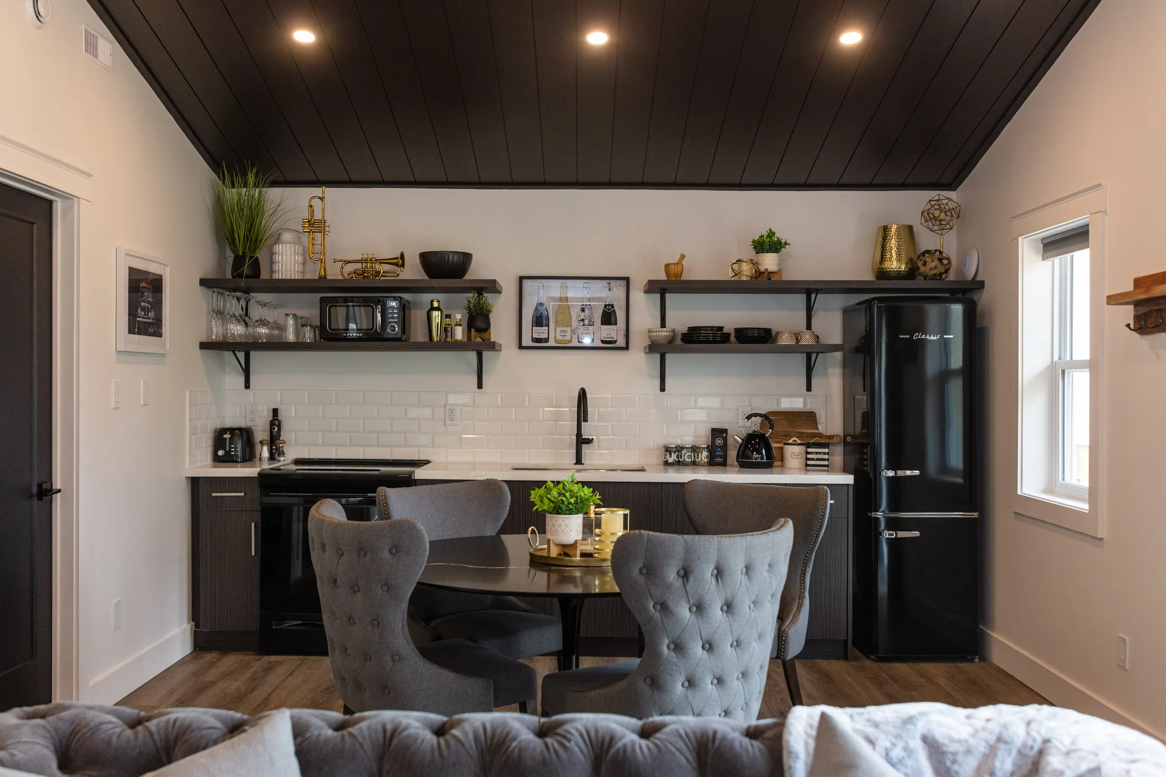 The Vintage Hollywood kitchen and dining area beneath a dark ceiling.